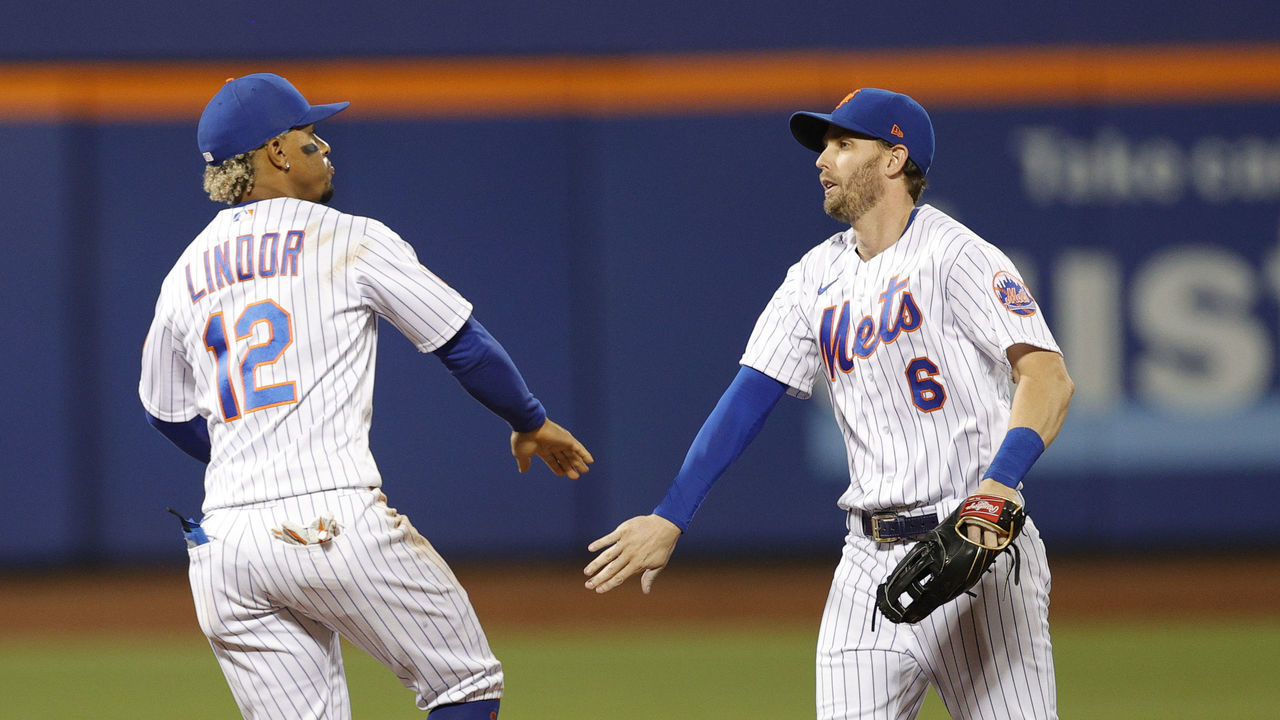 NEW YORK, NEW YORK - SEPTEMBER 19: Brandon Nimmo #9, Francisco Lindor #12, and Jeff McNeil #6 of the New York Mets celebrate their win during the ninth inning against the Philadelphia Phillies at Citi Field on September 19, 2021 in the Queens borough of New York City. The Mets won 3-2.