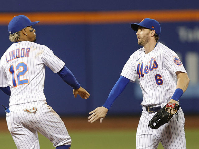NEW YORK, NEW YORK - SEPTEMBER 19: Brandon Nimmo #9, Francisco Lindor #12, and Jeff McNeil #6 of the New York Mets celebrate their win during the ninth inning against the Philadelphia Phillies at Citi Field on September 19, 2021 in the Queens borough of New York City. The Mets won 3-2.
