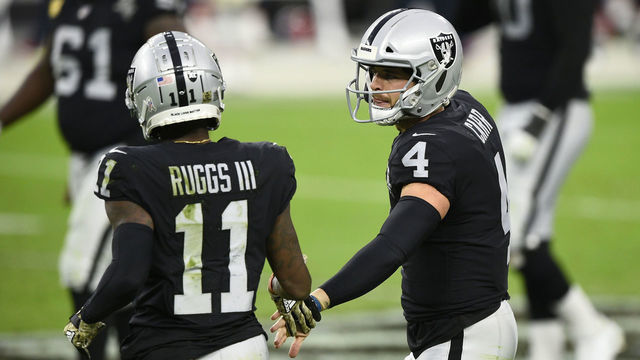 LAS VEGAS, NEVADA - NOVEMBER 15: Quarterback Derek Carr #4 and wide receiver Henry Ruggs III #11 of the Las Vegas Raiders celebrate in the second half of their game against the Denver Broncos at Allegiant Stadium on November 15, 2020 in Las Vegas, Nevada.