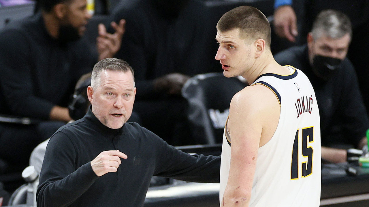 PORTLAND, OREGON - JUNE 03: Head coach Michael Malone of the Denver Nuggets talks with Nikola Jokic #15 in the fourth quarter against the Portland Trail Blazers during Round 1, Game 6 of the 2021 NBA Playoffs at Moda Center on June 03, 2021 in Portland, Oregon.