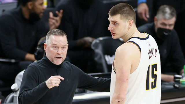 PORTLAND, OREGON - JUNE 03: Head coach Michael Malone of the Denver Nuggets talks with Nikola Jokic #15 in the fourth quarter against the Portland Trail Blazers during Round 1, Game 6 of the 2021 NBA Playoffs at Moda Center on June 03, 2021 in Portland, Oregon.