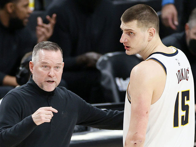 PORTLAND, OREGON - JUNE 03: Head coach Michael Malone of the Denver Nuggets talks with Nikola Jokic #15 in the fourth quarter against the Portland Trail Blazers during Round 1, Game 6 of the 2021 NBA Playoffs at Moda Center on June 03, 2021 in Portland, Oregon.
