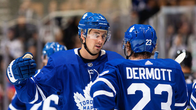 TORONTO, ON - OCTOBER 29: Toronto Maple Leafs defenseman Justin Holl #3 talks with teammate Travis Dermott at an NHL game against the Washington Capitals during the first period at the Scotiabank Arena on October 29, 2019 in Toronto, Ontario, Canada.