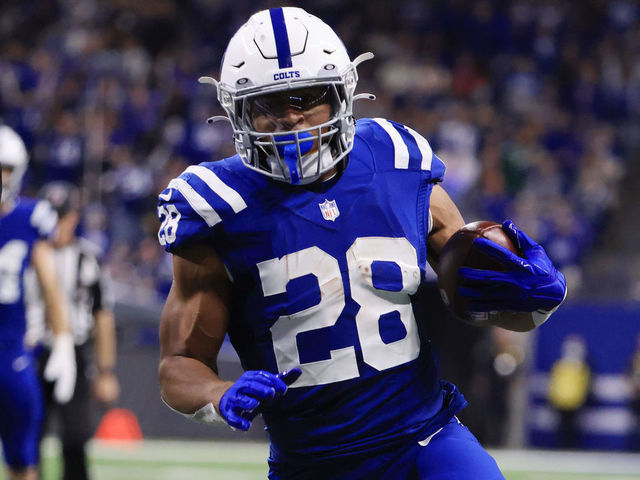 INDIANAPOLIS, INDIANA - NOVEMBER 04: Jonathan Taylor #28 of the Indianapolis Colts runs for a touchdown as Brandin Echols #26 of the New York Jets defends during the first half at Lucas Oil Stadium on November 04, 2021 in Indianapolis, Indiana.