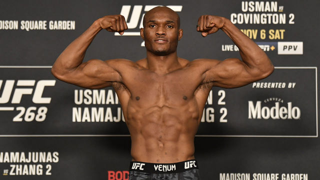 NEW YORK, NEW YORK - NOVEMBER 05: Kamaru Usman of Nigeria poses on the scale during the UFC 268 official weigh-in at the New York Hilton Midtown on November 05, 2021 in New York City.