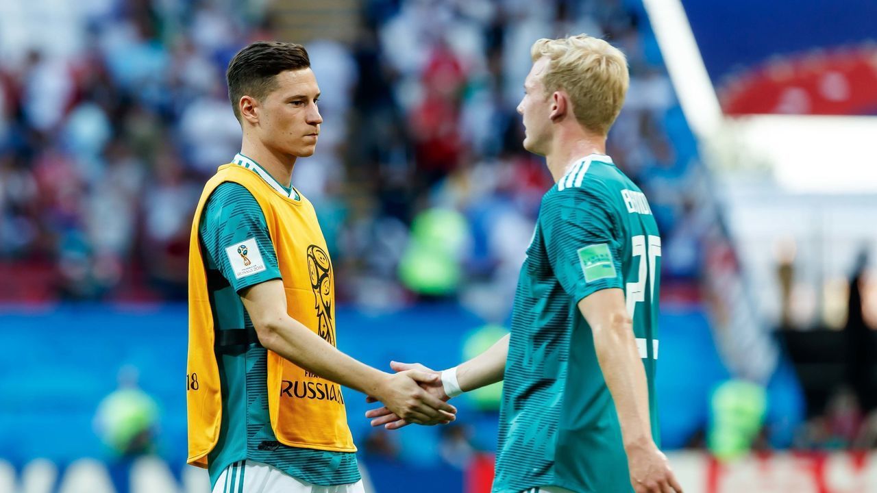 KAZAN, RUSSIA - JUNE 27: Julian Draxler of Germany and Julian Brandt of Germany look dejected after the 2018 FIFA World Cup Russia group F match between Korea Republic and Germany at Kazan Arena on June 27, 2018 in Kazan, Russia.