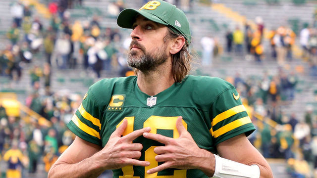GREEN BAY, WISCONSIN - OCTOBER 24: Aaron Rodgers #12 of the Green Bay Packers celebrates after beating the Washington Football Team 24-10 in the game at Lambeau Field on October 24, 2021 in Green Bay, Wisconsin.