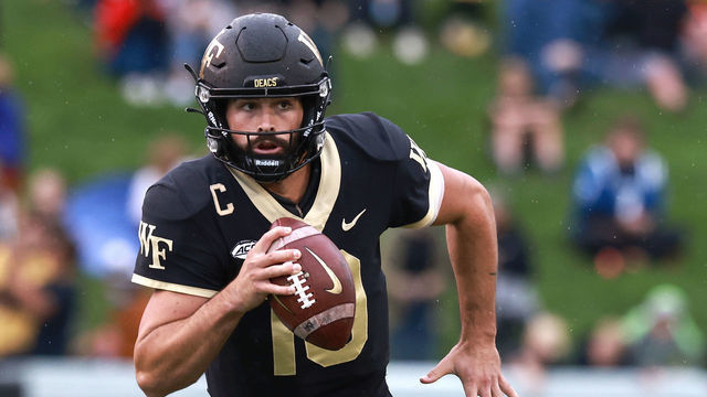 WINSTON-SALEM, NORTH CAROLINA - OCTOBER 30: Sam Hartman #10 of the Wake Forest Demon Deacons rolls out against the Duke Blue Devils during their game at Truist Field on October 30, 2021 in Winston-Salem, North Carolina. Wake Forest won 45-7.