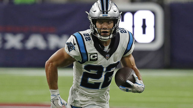 HOUSTON, TEXAS - SEPTEMBER 23: Christian McCaffrey #22 of the Carolina Panthers rushes against the Houston Texans at NRG Stadium on September 23, 2021 in Houston, Texas.