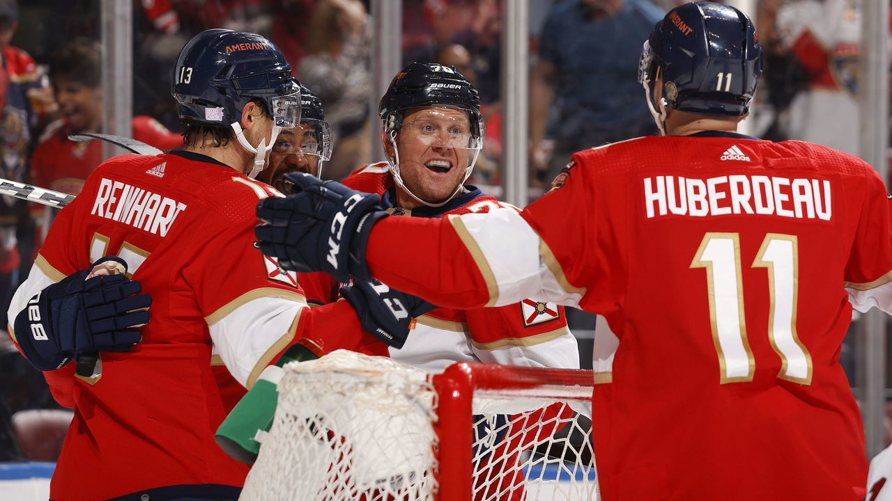 SUNRISE, FL - NOVEMBER 6: Patric Hornqvist #70 celebrates his first period goal with Jonathan Huberdeau #11 and Sam Reinhart #13 of the Florida Panthers against the Carolina Hurricanes at the FLA Live Arena on November 6, 2021 in Sunrise, Florida.