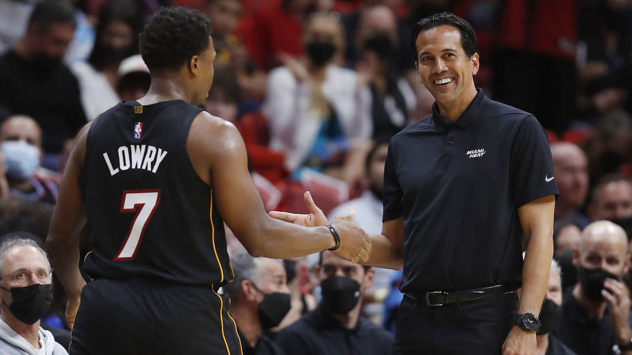 MIAMI, FLORIDA - NOVEMBER 06: Kyle Lowry #7 and head coach Erik Spoelstra of the Miami Heat high five against the Utah Jazz during the first half at FTX Arena on November 06, 2021 in Miami, Florida.