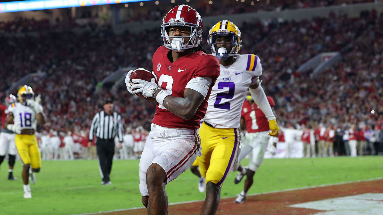 TUSCALOOSA, ALABAMA - NOVEMBER 06: John Metchie III #8 of the Alabama Crimson Tide pulls in this touchdown reception against Dwight McGlothern #2 of the LSU Tigers during the first half at Bryant-Denny Stadium on November 06, 2021 in Tuscaloosa, Alabama.