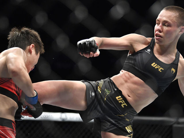 NEW YORK, NEW YORK - NOVEMBER 06: (R-L) Rose Namajunas kicks Zhang Weili of China in their UFC strawweight championship fight during the UFC 268 event at Madison Square Garden on November 06, 2021 in New York City.