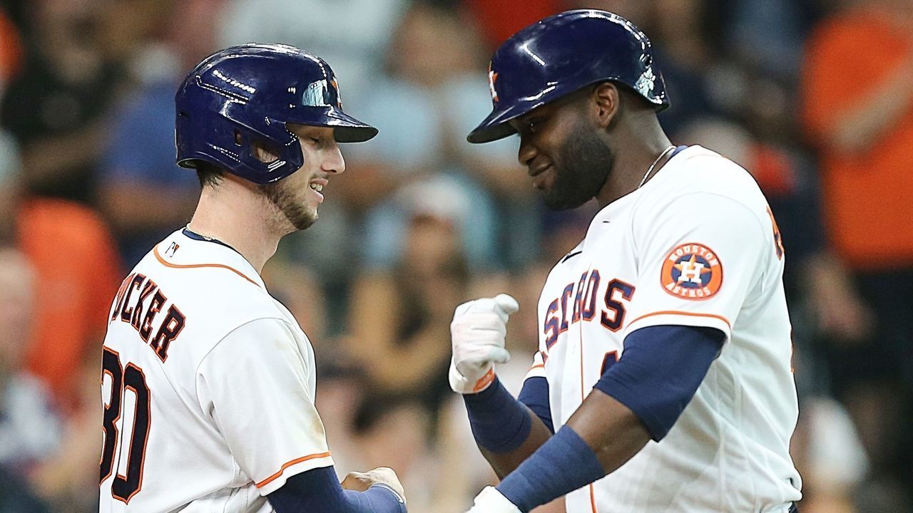 HOUSTON, TEXAS - AUGUST 07: Yordan Alvarez #44 of the Houston Astros is congratulated by Kyle Tucker #30 after hitting a home run in the fourth inning against the Minnesota Twins at Minute Maid Park on August 07, 2021 in Houston, Texas.