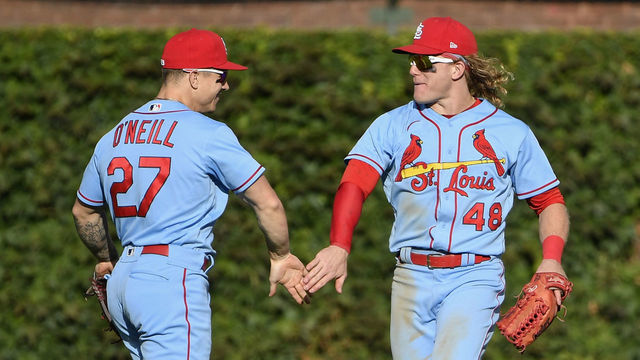 CHICAGO, ILLINOIS - SEPTEMBER 25: Tyler O'Neill #27 and Harrison Bader #48 of the St. Louis Cardinals celebrate the team win against the Chicago Cubs at Wrigley Field on September 25, 2021 in Chicago, Illinois.