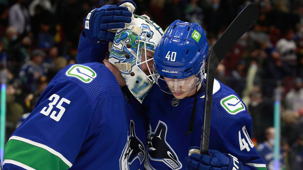 VANCOUVER, BC - NOVEMBER 7: Thatcher Demko #35 and Elias Pettersson #40 of the Vancouver Canucks celebrate after winning their NHL game against the Dallas Stars at Rogers Arena November 7, 2021 in Vancouver, British Columbia, Canada. Vancouver won 6-3.