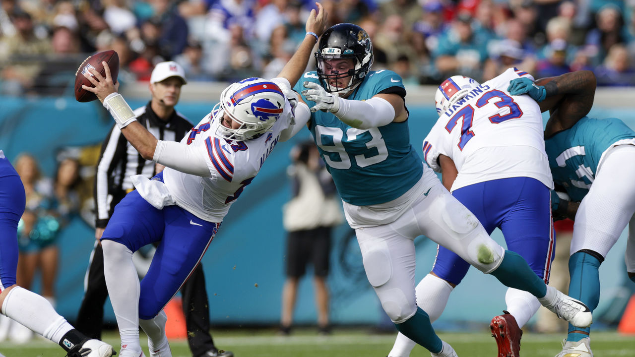 JACKSONVILLE, FL - NOVEMBER 07: Jacksonville Jaguars defensive tackle Taven Bryan (93) sacks .Buffalo Bills quarterback Josh Allen (17) during the game between the Buffalo Bills and the Jacksonville Jaguars on November 7, 2021 at TIAA Bank Field in Jacksonville, FL.