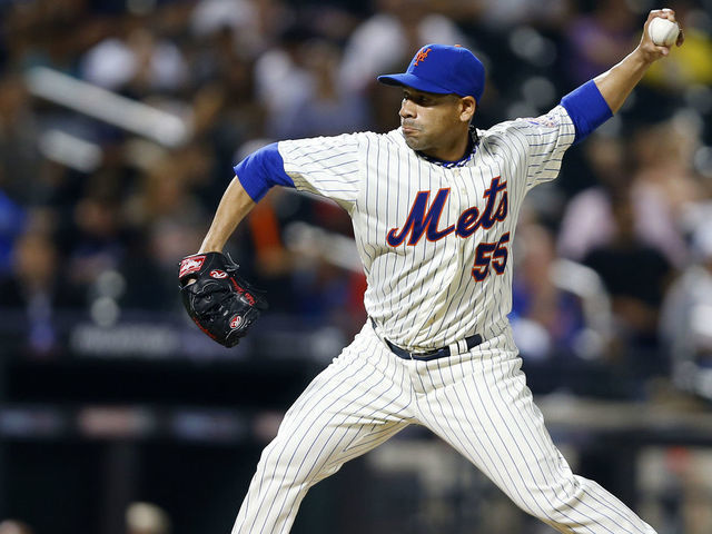 NEW YORK, NY - AUGUST 26: Pitcher Pedro Feliciano #55 of the New York Mets elixirs a pitch against the Philadelphia Phillies on August 26, 2013 at Citi Field in the Flushing neighborhood of the Queens borough of New York City.
