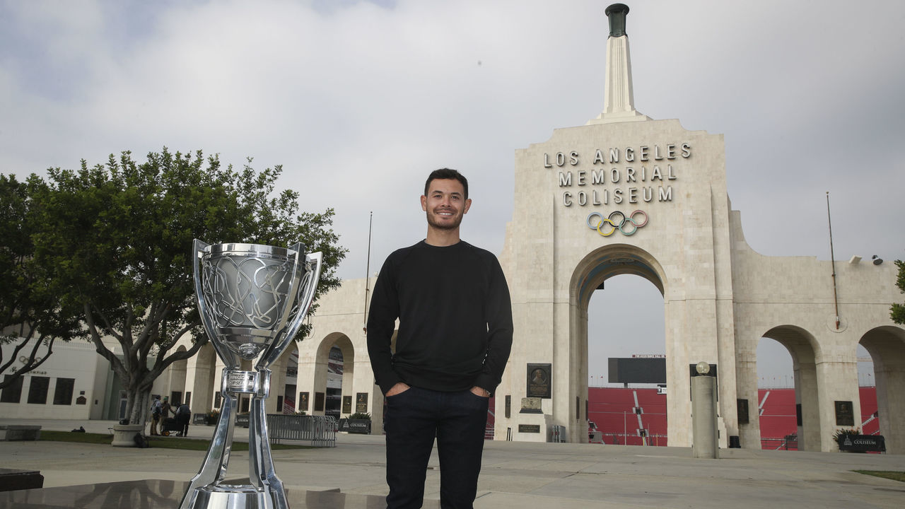 LOS ANGELES, CALIFORNIA - NOVEMBER 09: The 2021 NASCAR Cup Series championship driver, Kyle Larson poses for photos at the Los Angeles Memorial Coliseum on November 09, 2021 in Los Angeles, California.