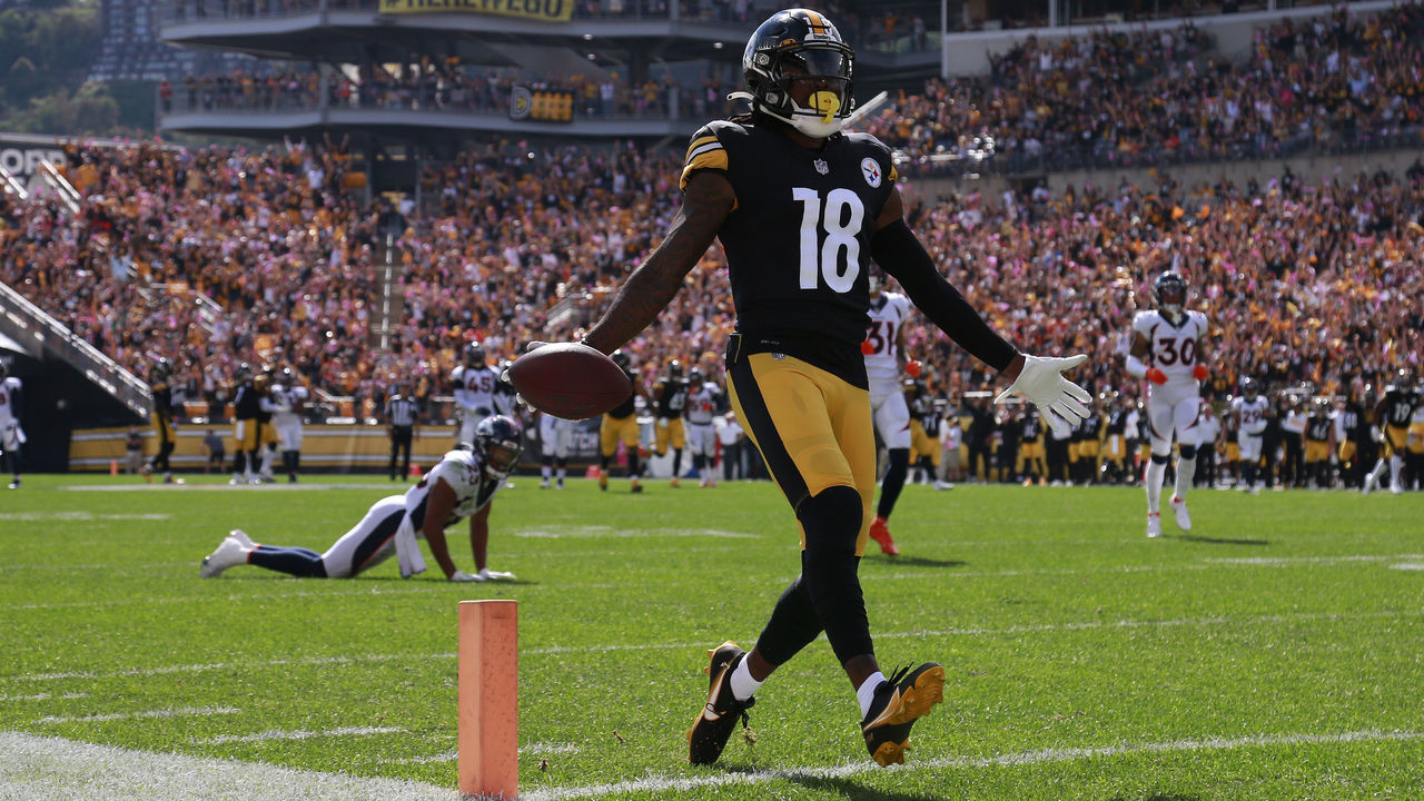 PITTSBURGH, PENNSYLVANIA - OCTOBER 10: Diontae Johnson #18 of the Pittsburgh Steelers crosses the goal line to score a 50-yard touchdown reception against the Denver Broncos during the first quarter at Heinz Field on October 10, 2021 in Pittsburgh, Pennsylvania.
