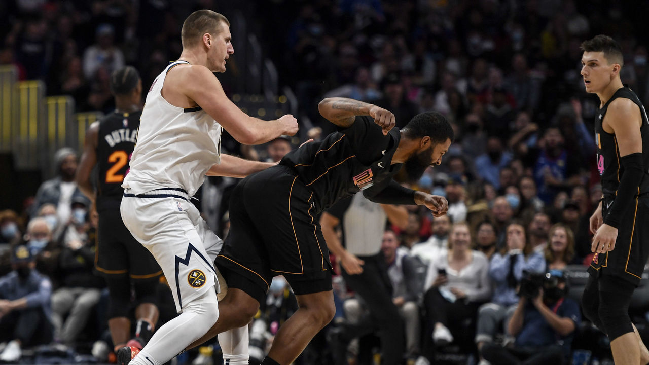 DENVER, CO - NOVEMBER 8: Nikola Jokic (15) of the Denver Nuggets hits Markieff Morris (8) of the Miami Heat with a retaliatory blow after Morris bumped Jokic near mid court during the fourth quarter of Denver"u2019s 113-96 win on Monday, November 8, 2021. The altercation resulted in an ejection for Jokic and a flagrant and two for Morris.
