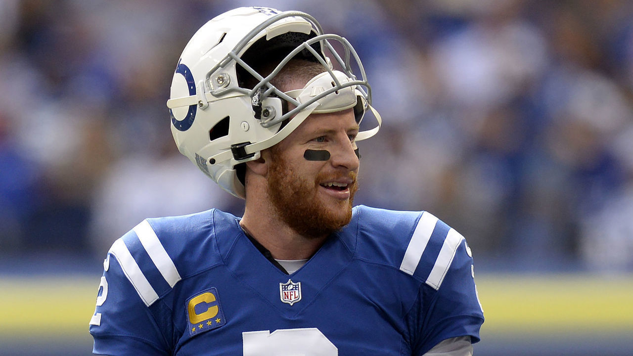 INDIANAPOLIS, IN - OCTOBER 31: Indianapolis Colts Quarterback Carson Wentz (2) smiles at the sideline during a timeout in the NFL football game between the Tennessee Titans and the Indianapolis Colts on October 31, 2021, at Lucas Oil Stadium in Indianapolis, Indiana.