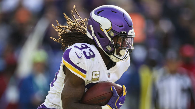 BALTIMORE, MD - NOVEMBER 07: Dalvin Cook #33 of the Minnesota Vikings carries the ball against the Baltimore Ravens during the first half at M&T Bank Stadium on November 7, 2021 in Baltimore, Maryland.
