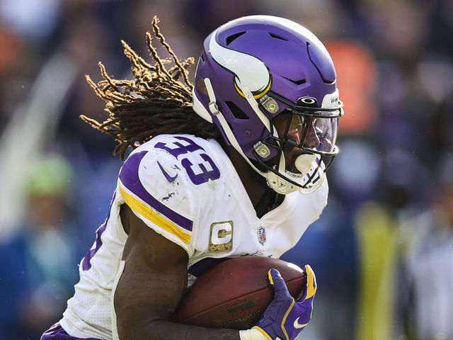 BALTIMORE, MD - NOVEMBER 07: Dalvin Cook #33 of the Minnesota Vikings carries the ball against the Baltimore Ravens during the first half at M&T Bank Stadium on November 7, 2021 in Baltimore, Maryland.
