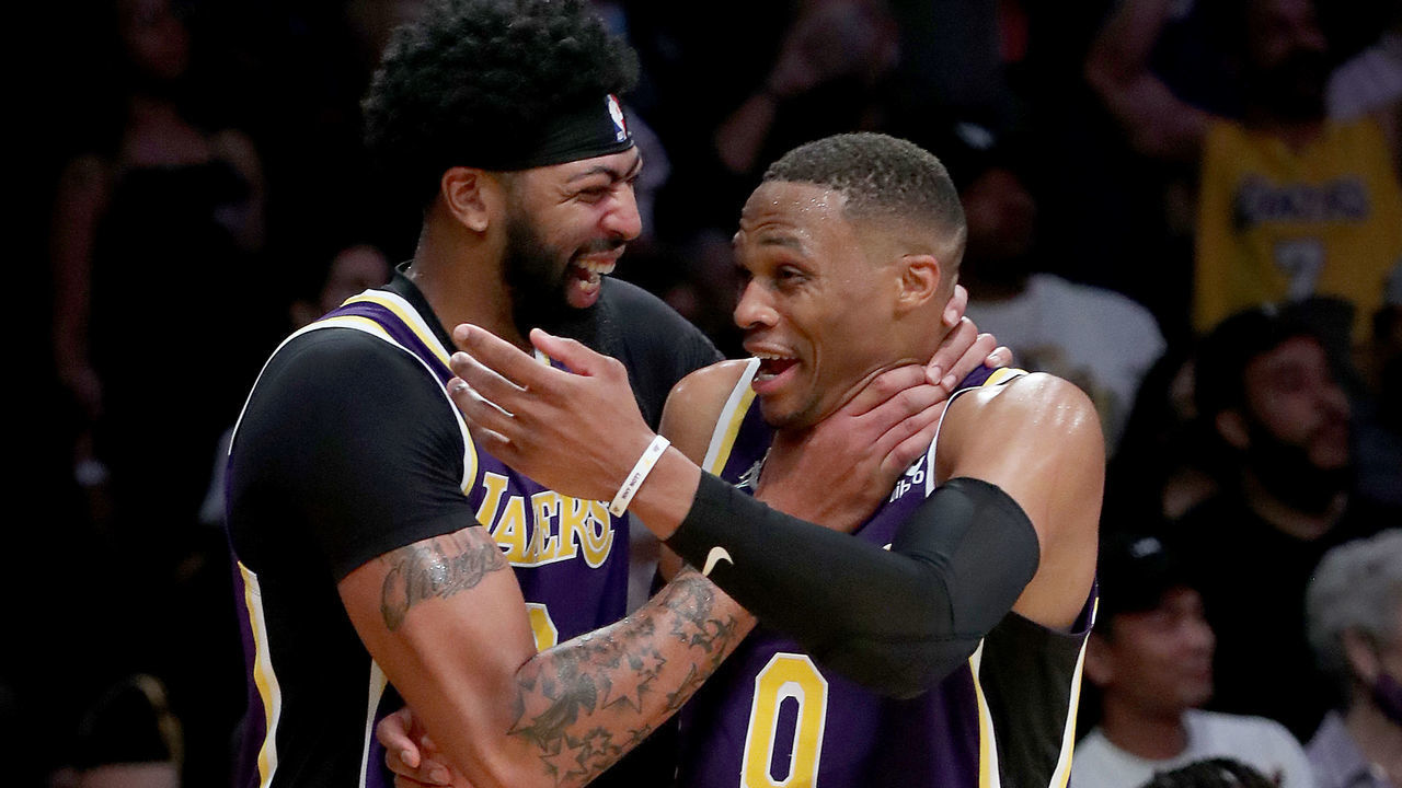 LOS ANGELES, CALIF. - OCT. 29, 2021. Lakers Anthony Davis, left, and Russell Westbrook celebrate a victory against the Cavaliers at Staples Center in Los Angeles on Friday, Oct. 29, 2021. (Luis Sinco / Los Angeles Times via Getty Images)