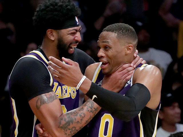 LOS ANGELES, CALIF. - OCT. 29, 2021. Lakers Anthony Davis, left, and Russell Westbrook celebrate a victory against the Cavaliers at Staples Center in Los Angeles on Friday, Oct. 29, 2021. (Luis Sinco / Los Angeles Times via Getty Images)