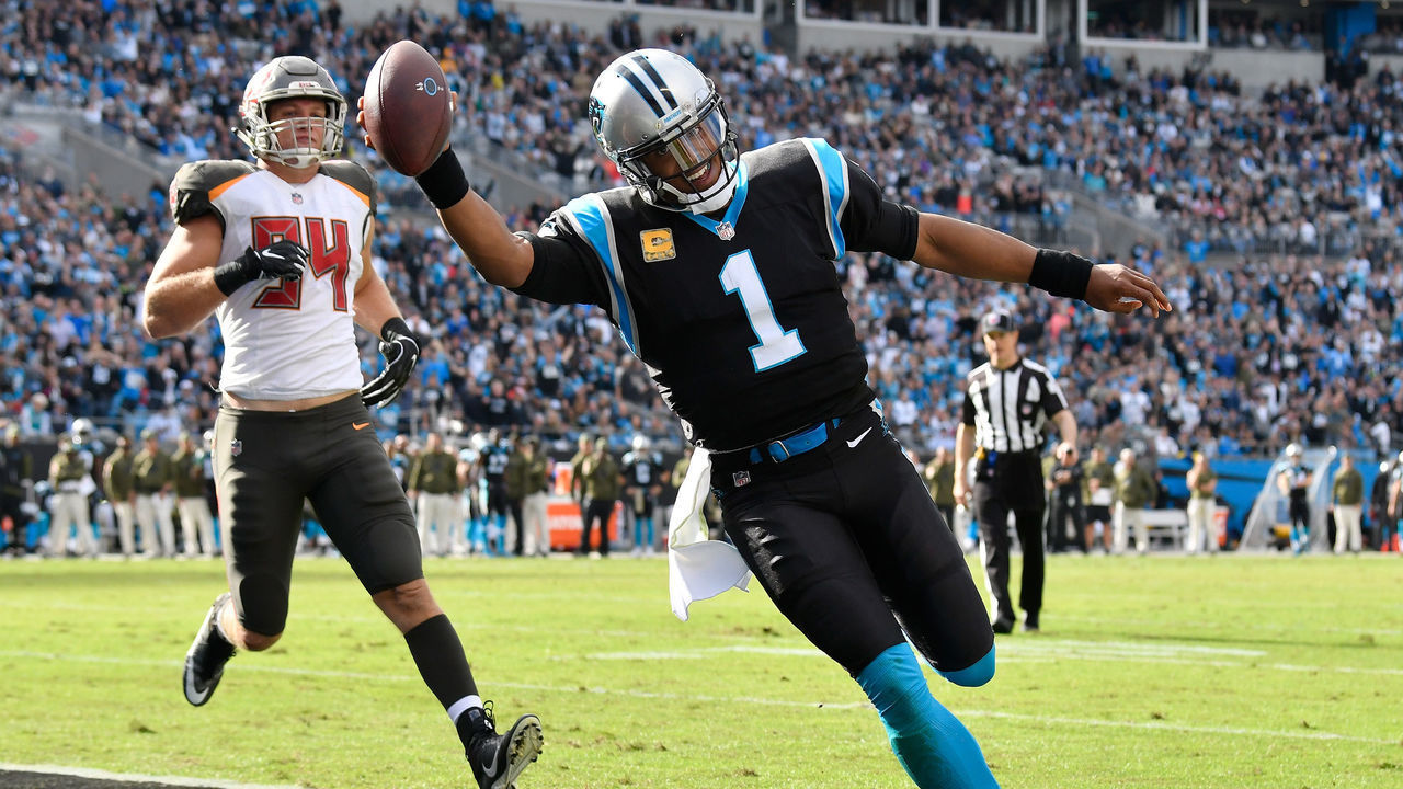 CHARLOTTE, NC - NOVEMBER 04: Cam Newton #1 of the Carolina Panthers beats Carl Nassib #94 of the Tampa Bay Buccaneers to the goal line during the first half at Bank of America Stadium on November 4, 2018 in Charlotte, North Carolina. The play was called back on a penalty.