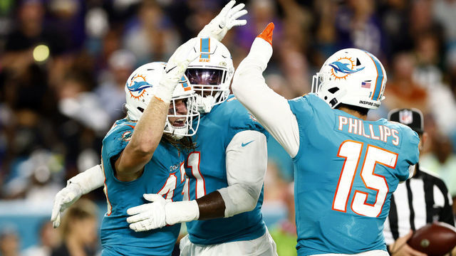 MIAMI GARDENS, FLORIDA - NOVEMBER 11: Andrew Van Ginkel #43, Emmanuel Ogbah #91, and Jaelan Phillips #15 of the Miami Dolphins celebrate a sack on Lamar Jackson #8 (not pictured) of the Baltimore Ravens in the first quarter in the game at Hard Rock Stadium on November 11, 2021 in Miami Gardens, Florida.