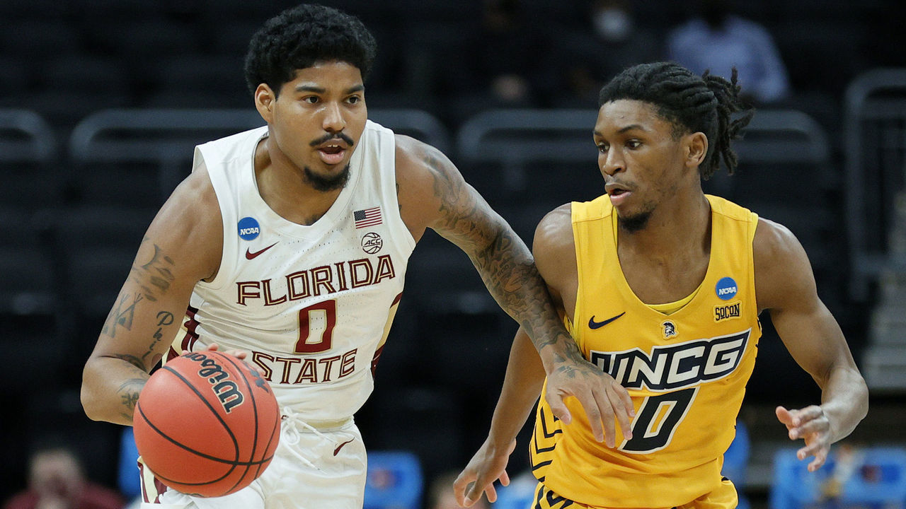 INDIANAPOLIS, INDIANA - MARCH 20: RayQuan Evans #0 of the Florida State Seminoles dribbles against Keyshaun Langley #0 of the UNC-Greensboro Spartans during the first half in the first round game of the 2021 NCAA Men's Basketball Tournament at Bankers Life Fieldhouse on March 20, 2021 in Indianapolis, Indiana.