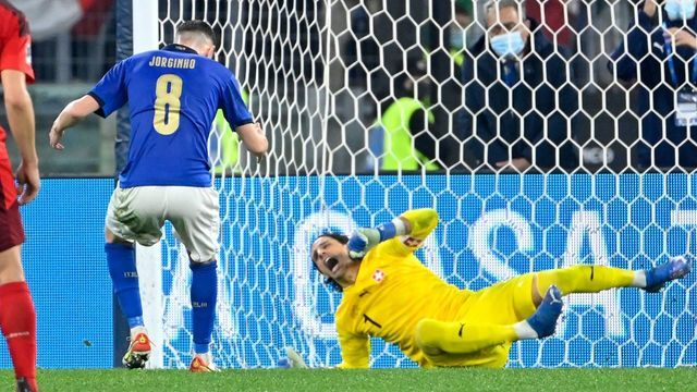 Switzerland's goalkeeper Yann Sommer (R) reacts next to Italy's midfielder Jorginho after Jorginho missed a penalty during the FIFA World Cup Qatar 2022 qualification Group C football match between Italy and Switzerland on November 12, 2021 at the Olympic stadium in Rome.