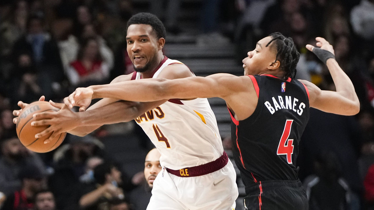 TORONTO, ON - NOVEMBER 5: Evan Mobley #4 of the Cleveland Cavaliers is defended by Scottie Barnes #4 of the Toronto Raptors during the second half of their basketball game at the Scotiabank Arena on November 5, 2021 in Toronto, Ontario, Canada. NOTE TO USER: User expressly acknowledges and agrees that, by downloading and/or using this Photograph, user is consenting to the terms and conditions of the Getty Images License Agreement.