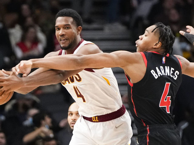 TORONTO, ON - NOVEMBER 5: Evan Mobley #4 of the Cleveland Cavaliers is defended by Scottie Barnes #4 of the Toronto Raptors during the second half of their basketball game at the Scotiabank Arena on November 5, 2021 in Toronto, Ontario, Canada. NOTE TO USER: User expressly acknowledges and agrees that, by downloading and/or using this Photograph, user is consenting to the terms and conditions of the Getty Images License Agreement.