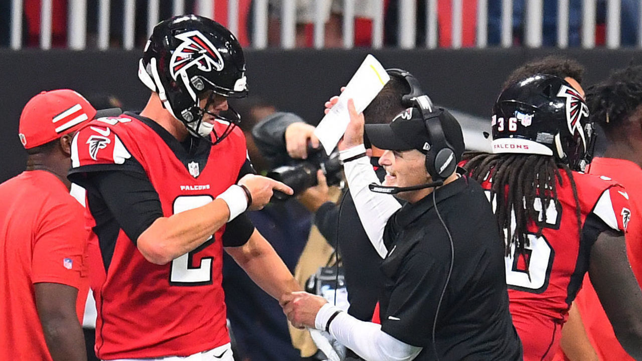 ATLANTA, GA - SEPTEMBER 23: Matt Ryan #2 of the Atlanta Falcons is congratulated by Head Coach Dan Quinn after throwing a second quarter touchdown pass against the New Orleans Saints at Mercedes-Benz Stadium on September 23, 2018 in Atlanta, Georgia.