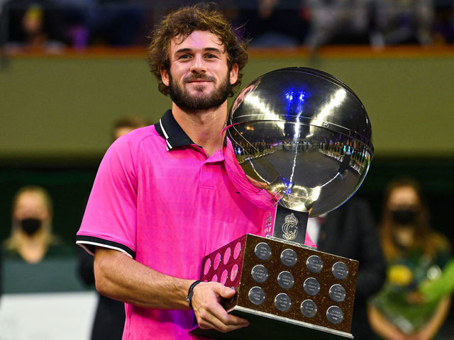 USA's Tommy Paul poses with the trophy after winning his singles final match against Canada's Denis Shapovalov (not in picture) at the ATP Stockholm Open tennis tournament in Stockholm on November 13, 2021.