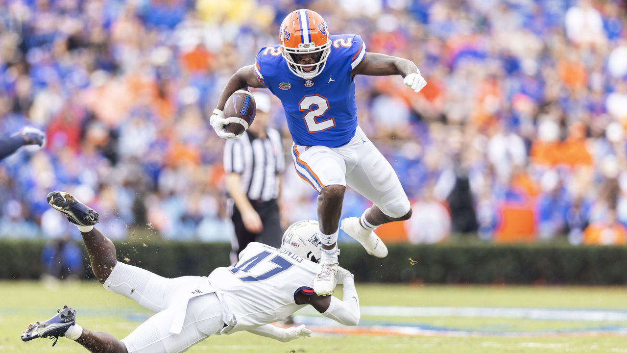GAINESVILLE, FLORIDA - NOVEMBER 13: Kemore Gamble #2 of the Florida Gators hurtles Chris Edmonds #47 of the Samford Bulldogs during the first quarter of a game at Ben Hill Griffin Stadium on November 13, 2021 in Gainesville, Florida.