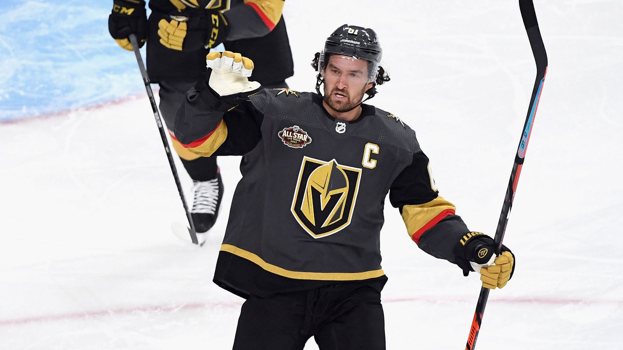 LAS VEGAS, NEVADA - OCTOBER 12: Mark Stone #61 of the Vegas Golden Knights celebrates a first period goal by Max Pacioretty #67 (not shown) against Philipp Grubauer #31 of the Seattle Kraken at T-Mobile Arena on October 12, 2021 in Las Vegas, Nevada.