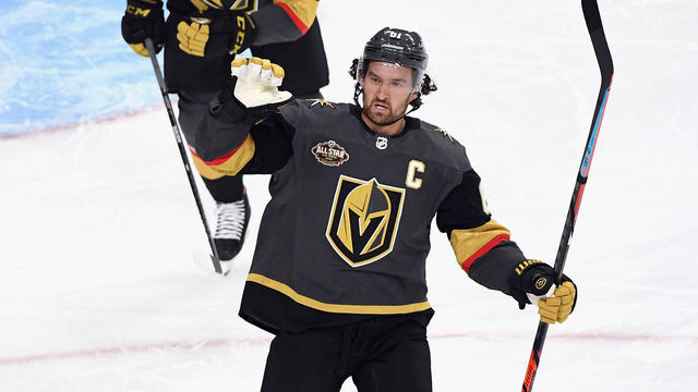 LAS VEGAS, NEVADA - OCTOBER 12: Mark Stone #61 of the Vegas Golden Knights celebrates a first period goal by Max Pacioretty #67 (not shown) against Philipp Grubauer #31 of the Seattle Kraken at T-Mobile Arena on October 12, 2021 in Las Vegas, Nevada.