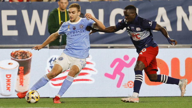 FOXBOROUGH, MA - SEPTEMBER 11: New York City FC midfielder James Sands (16) plays the ball away from New England Revolution forward Edward Kizza (19) during a match between the New England Revolution and New York City FC on September 11, 2021 at Gillette Stadium in Foxborough, Massachusetts.