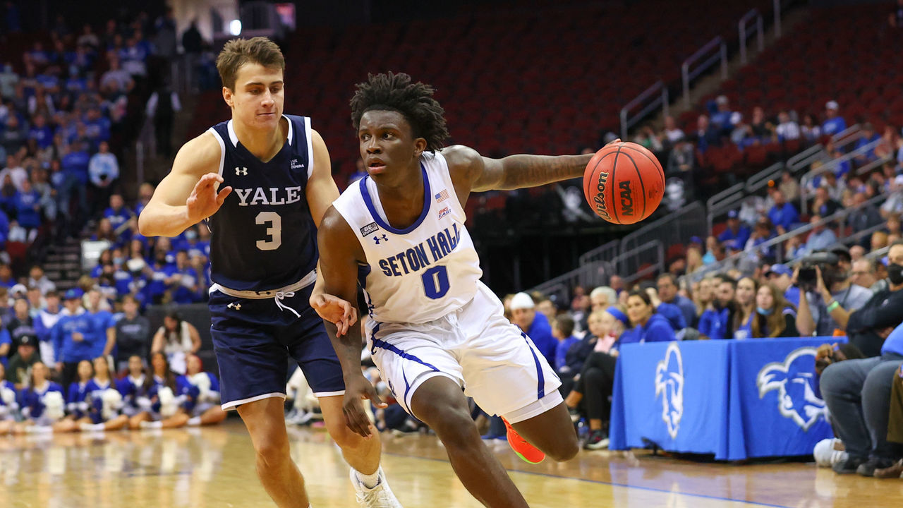 NEWARK, NJ - NOVEMBER 14: Seton Hall Pirates guard Kadary Richmond (0) drives against Yale Bulldogs guard August Mahoney (3) during the second half of the college basketball game between the Seton Hall Pirates and Yale Bulldogs on November 14, 2021 at the Prudential Center in Newark, NJ.