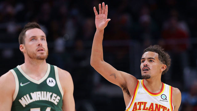 ATLANTA, GEORGIA - NOVEMBER 14: Trae Young #11 of the Atlanta Hawks reacts after a basket against the Milwaukee Bucks during the second half at State Farm Arena on November 14, 2021 in Atlanta, Georgia.