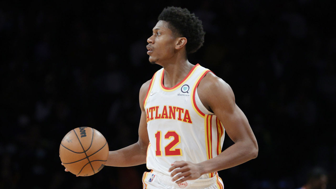 NEW YORK, NEW YORK - NOVEMBER 03: De'Andre Hunter #12 of the Atlanta Hawks dribbles during the first half against the Brooklyn Nets at Barclays Center on November 03, 2021 in the Brooklyn borough of New York City.