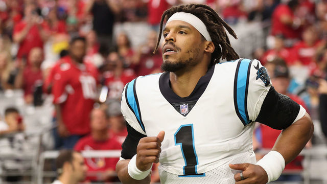 GLENDALE, ARIZONA - NOVEMBER 14: Quarterback Cam Newton #1 of the Carolina Panthers runs out to the field before the NFL game against the Arizona Cardinals at State Farm Stadium on November 14, 2021 in Glendale, Arizona. The Panthers defeated the Cardinals 34-10.