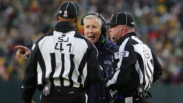 GREEN BAY, WISCONSIN - NOVEMBER 14: Head Coach Pete Carroll of the Seattle Seahawks speaks to officials during the second half against the Green Bay Packers at Lambeau Field on November 14, 2021 in Green Bay, Wisconsin.
