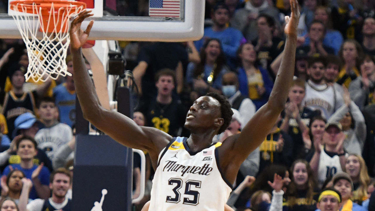 MILWAUKEE, WISCONSIN - NOVEMBER 15: Kur Kuath #35 of the Marquette Golden Eagles celebrates a win after a college basketball game against the Illinois Fighting Illini at the Fiserv Forum on November 15, 2021 in Milwaukee, Wisconsin.