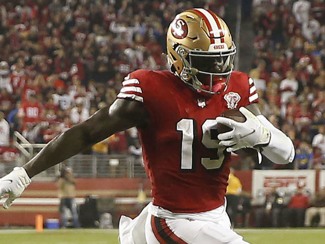 SANTA CLARA, CALIFORNIA - NOVEMBER 15: Deebo Samuel #19 of the San Francisco 49ers runs for a touchdown against Robert Rochell #31 of the Los Angeles Rams in the second quarter at Levi's Stadium on November 15, 2021 in Santa Clara, California.