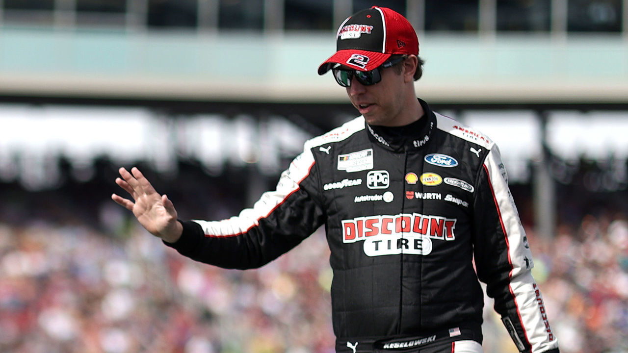 AVONDALE, ARIZONA - NOVEMBER 07: Brad Keselowski, driver of the #2 Discount Tire Ford, waves to fans as he walks onstage during pre-race ceremonies prior to the NASCAR Cup Series Championship at Phoenix Raceway on November 07, 2021 in Avondale, Arizona.